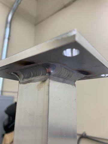Aluminum post weldment with mounting flange